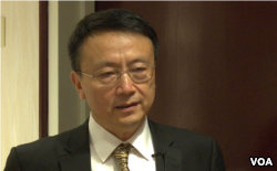 北大教授贾庆国在华盛顿一个智库的研讨会上(2014年4月19日，美国之音黎堡拍摄)