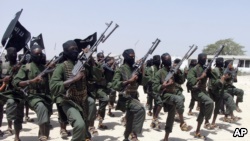 FILE - Hundreds of newly trained al-Shabab fighters perform military exercises in the Lafofe area 18 km south of Mogadishu, Somalia, Feb. 17, 2017. 